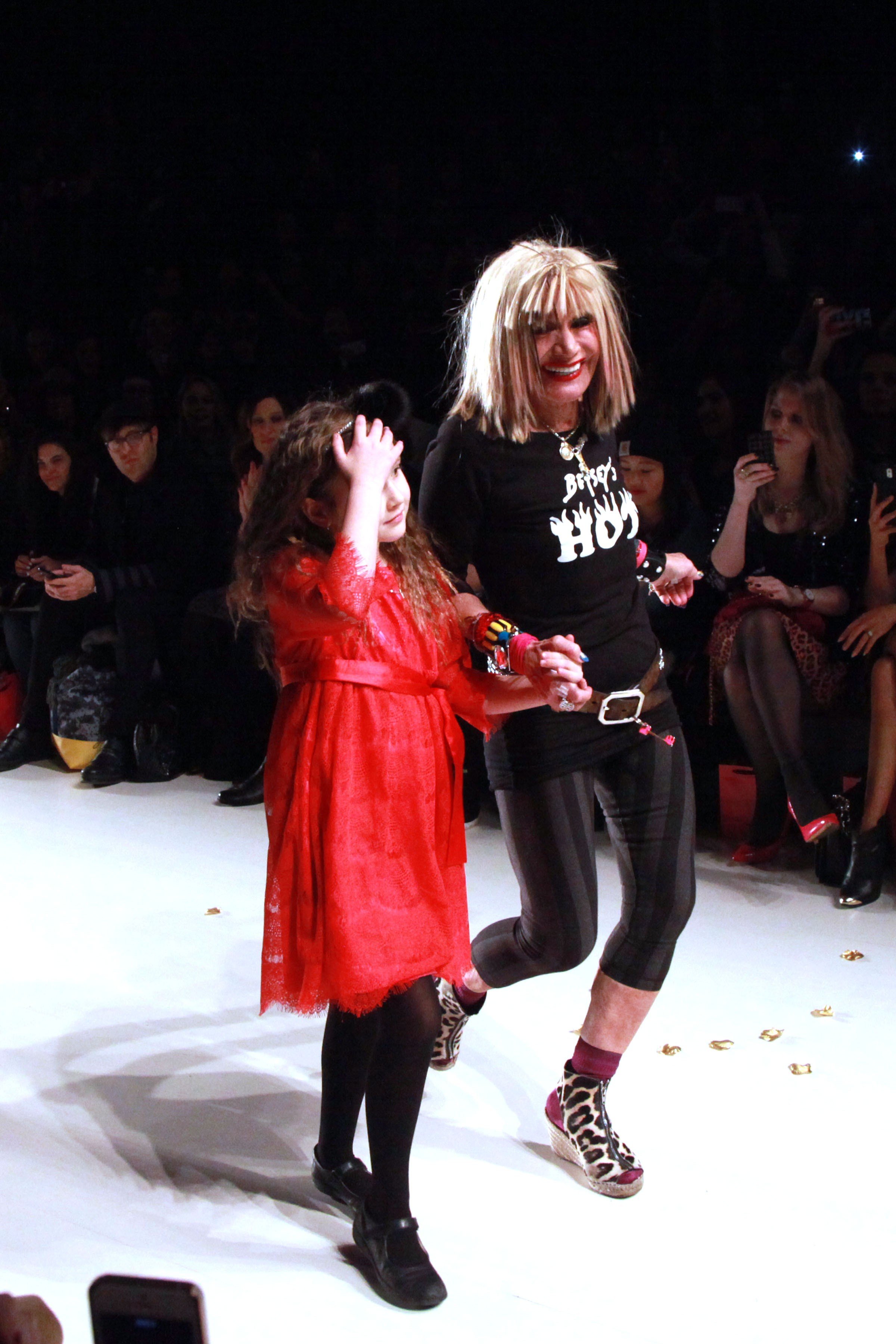 Betsey Johnson walks the catwalk with granddaughter Ella during the finale of her show. ©Patrick McMullan J.Grassi/PatrickMcMullan.com