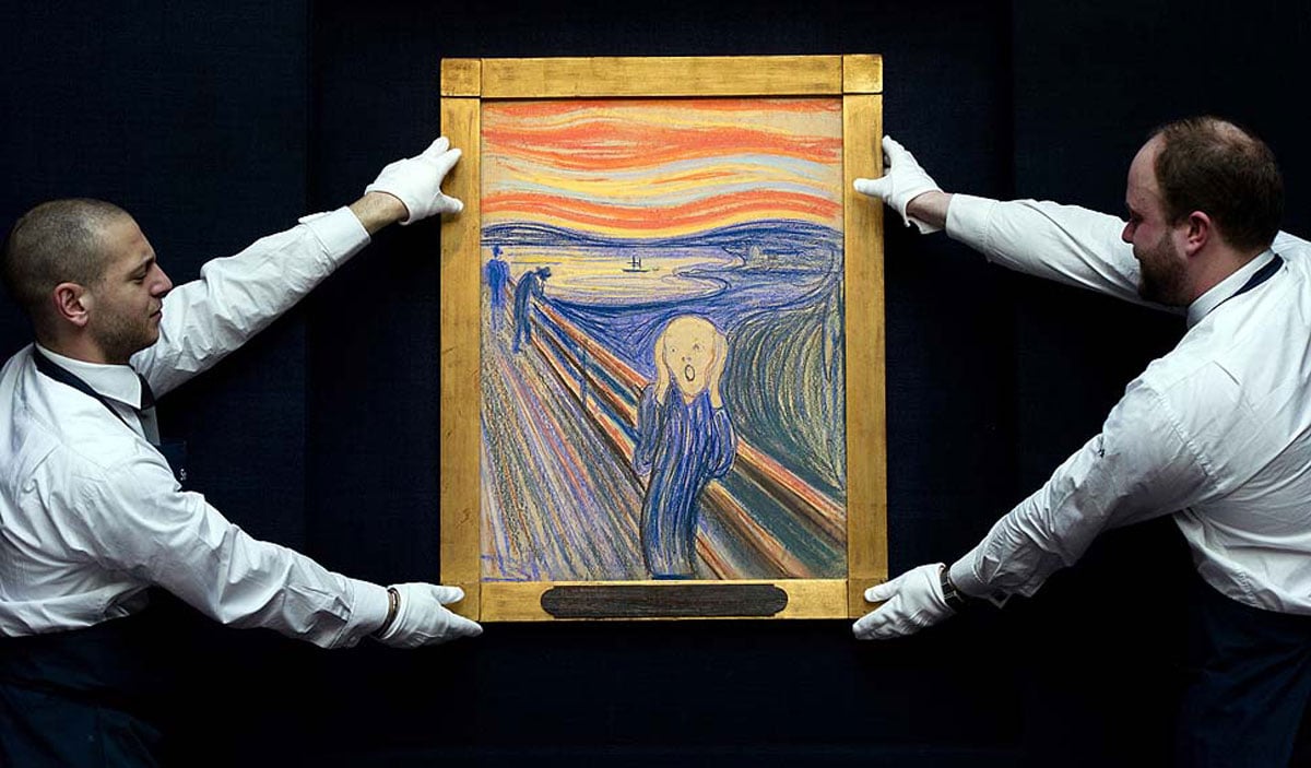 Sotheby's employees pose for a photograph with Edvard Munch's " The Scream", sold at Sotheby's in May 2012