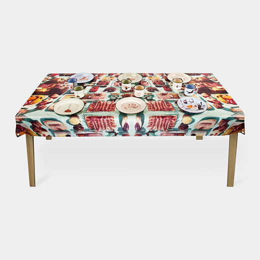 While we doubt we could keep a bite down eating on top of this Cattelan & Ferrari tablecloth illustrated with bug-infested food, some people may have stronger stomaches and more avant-garde sensibilities.  Image: MoMA Design Store