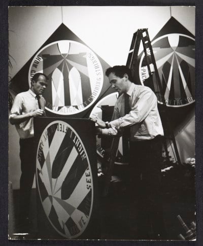 Alan Groh and Robert Indiana installing a show at the Stable Gallery, 1964 / Nancy Astor, photographer. Stable Gallery records, Archives of American Art, Smithsonian Institution.