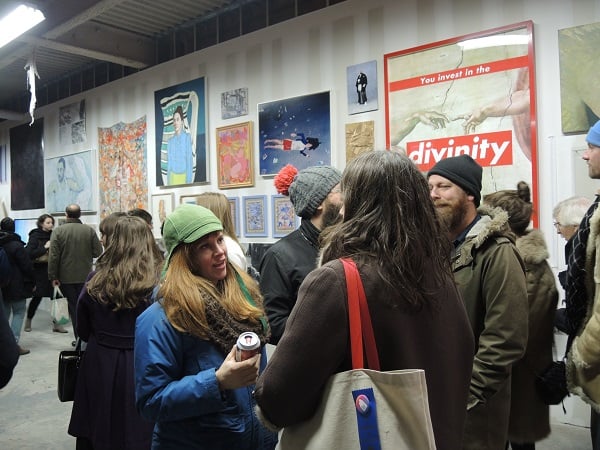 Guests in front of work by Barbara Kruger at the 2014 Brucennial.