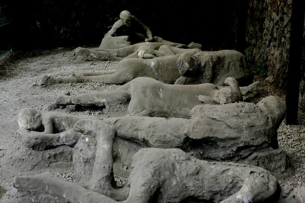 Plaster casts of victims, at Garden of the Fugitives in Pompeii, Italy. Photo by Martin Godwin/Getty Images.