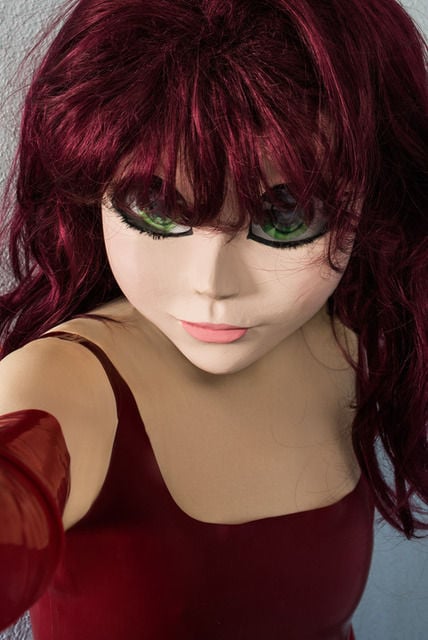 Laurie Simmons "Redhead/Red Dress/Selfie" proves that you need not be human to take a perfect selfie.
