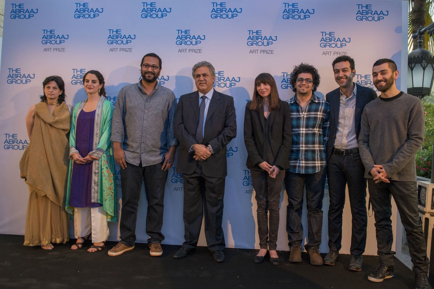 The Abraaj Group Art Prize 2014 Exhibition Opening Chairwoman Savita Apte, curator Nada Raza, Abraaj Group founder Arif Naqvi, and 2014 winners: Anup Mathew Thomas, Bouchra Khalili, Basim Magdy, Kamrooz Aram, Abbas Akhavan Courtesy Art Dubai 2014