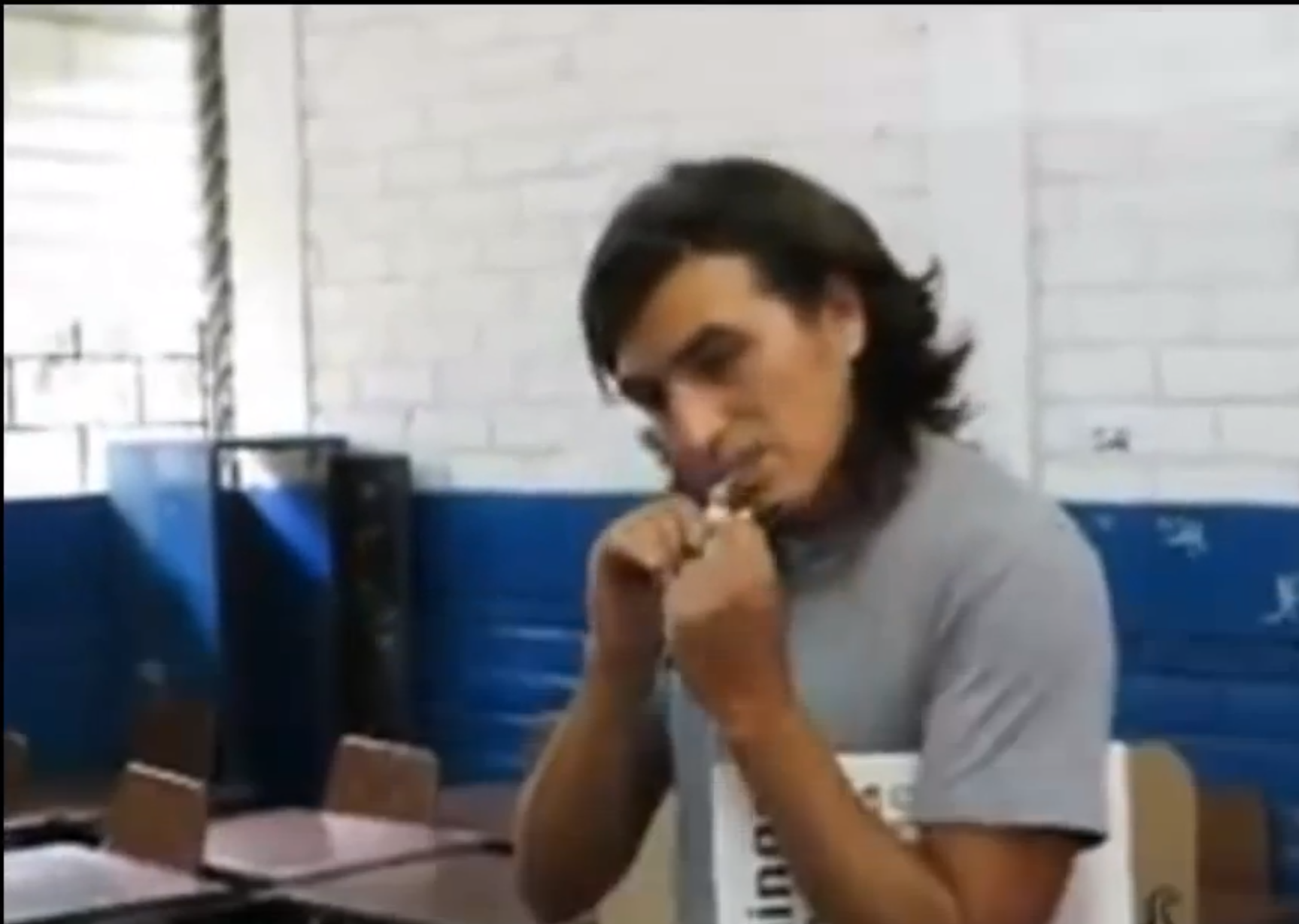 Artist Víctor “Crack” Rodríguez eats his ballot (screenshot via YouTube)