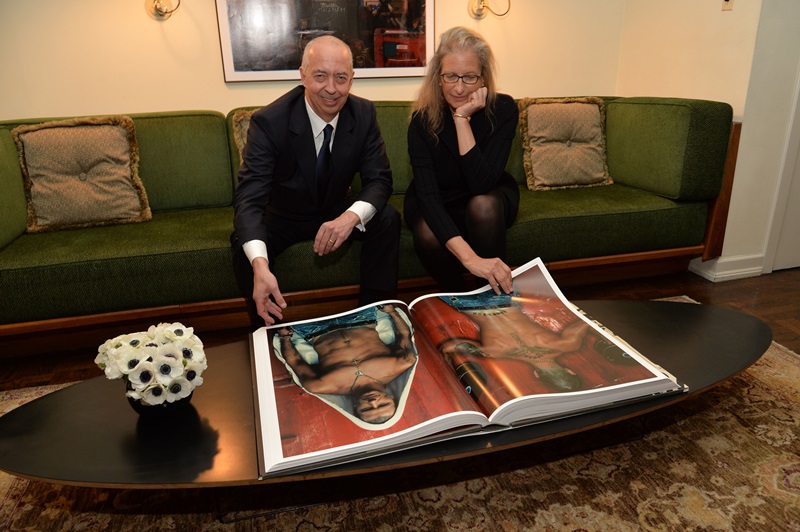 Benedikt Taschen and Annie Leibovitz view the enormous book at its launch party at the Chateau Marmont. Photo:  TASCHEN