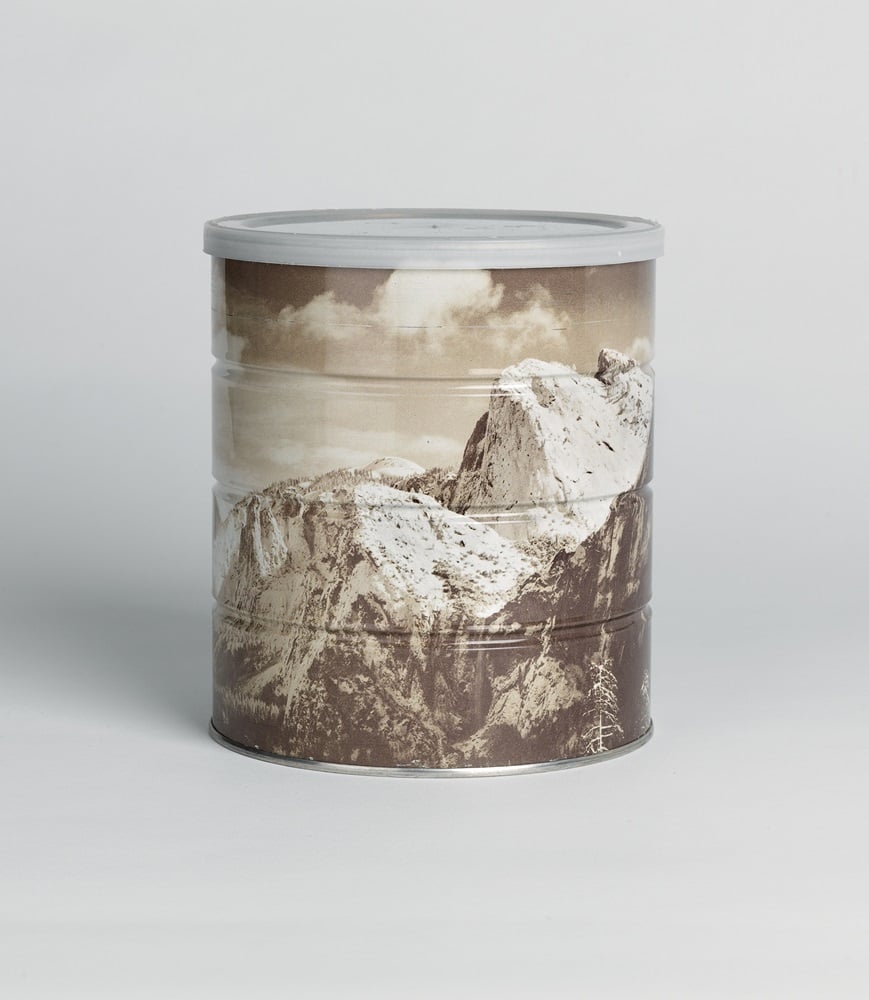 A Hills Brothers Coffee can, estimated at $900 to $1,200, featuring a reproduction of Ansel Adams' Winter Morning, Yosemite Valley, California. Cylindrical tin,with Hills Brothers' and Adams' printed credit and the date on the side; and with the original plastic top with a price of $2.05 stamped on the lid (1969) Photo: Courtesty of Swann Galleries