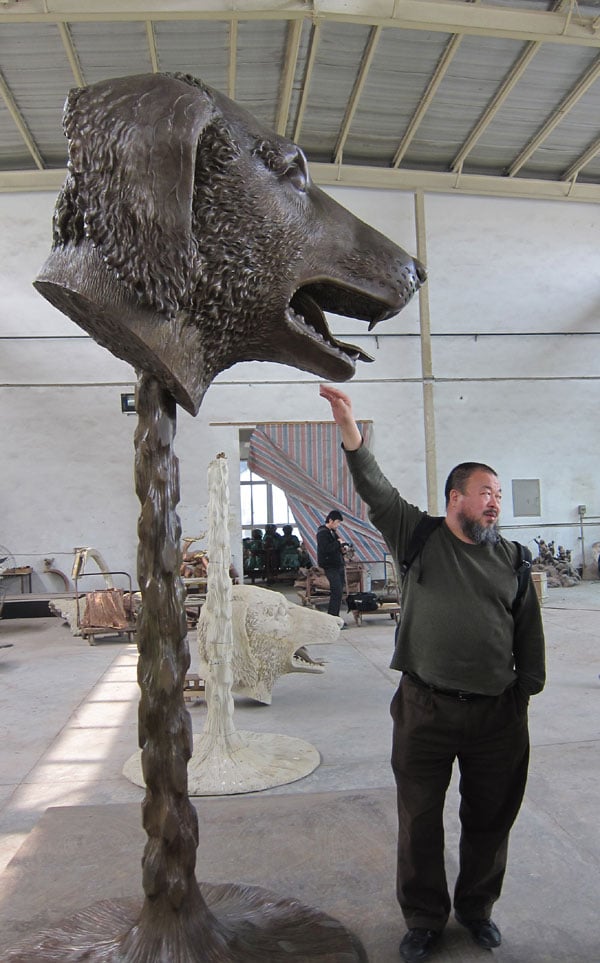 Ai Weiwei pictured with his dog head, part of the exhibition "Circle of Animals/Zodiac Heads" (2010). Photo: courtesy the artist.