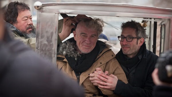Ai Weiwei gives cinematographer Christopher Doyle a haircut. Courtesy Jason Wishnow.