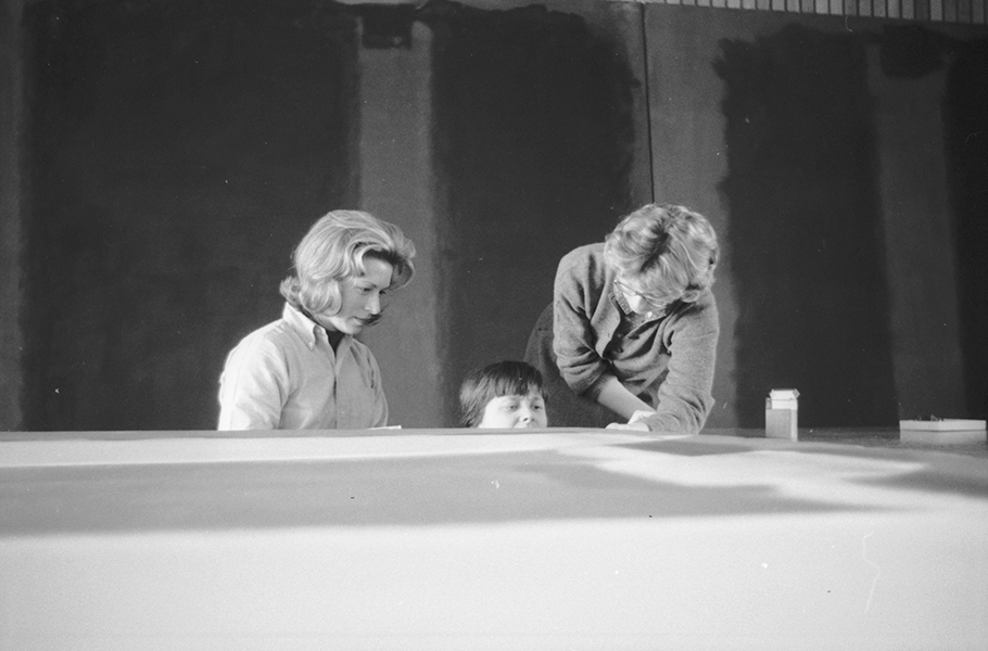 Conservators Jean Lampton (Woodward), Marjorie Cohn, and Sue Ellen Crampton stretching Panel Five, in front of Panel Two and Panel Three of the Harvard Murals, Holyoke Center, January 1963. Photo: Elizabeth H. Jones, courtesy President and Fellows of Harvard College.