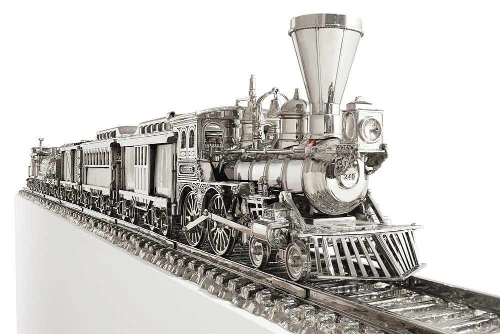 Jeff Koons (B. 1955) Jim Beam - J.B. Turner Train stainless steel and bourbon 11 x 114 x 6½ in. (27.9 x 289.6 x 16.5 cm.) Executed in 1986. This work is the artist's proof from an edition of three plus one artist's proof.