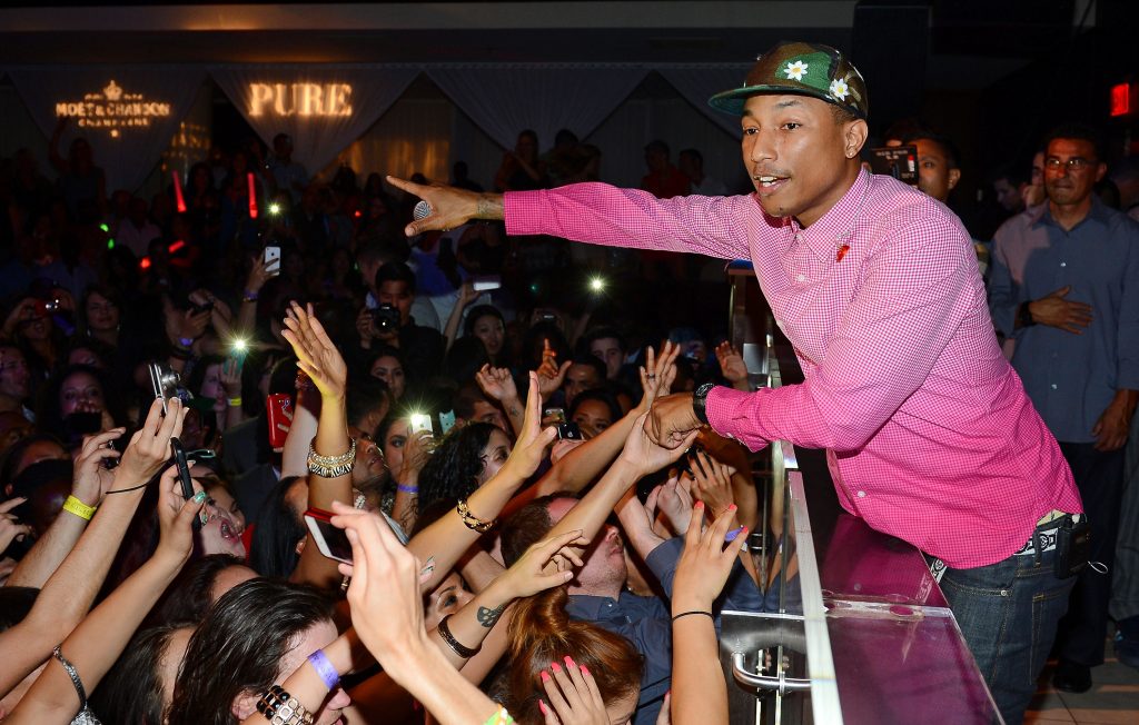 Pharrell Williams performing in 2013. Photo by Ethan Miller/Getty Images for PURE Nightclub.