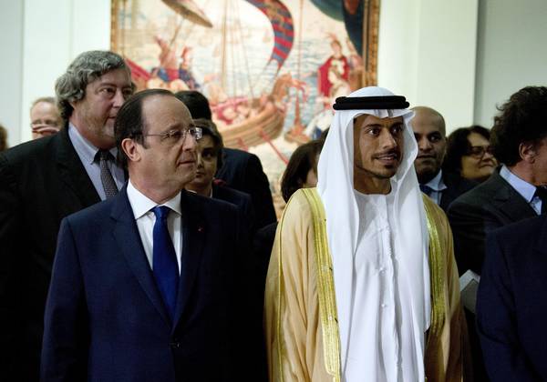 French President Francois Hollande and Sheikh Sultan Bin Tahnoon Al Nahyan, chairman of the Abu Dhabi Tourism and Culture Authority, visit the exhibition 