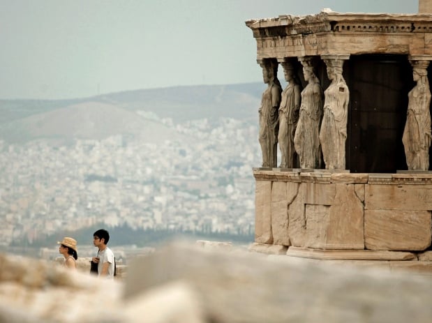 Replicas of the caryatid statues that replaced the originals due pollution concerns in 1979 at the Erechtheion temple on the Acropolis. Photo: Petros Giannakouris courtesy Associated Press.