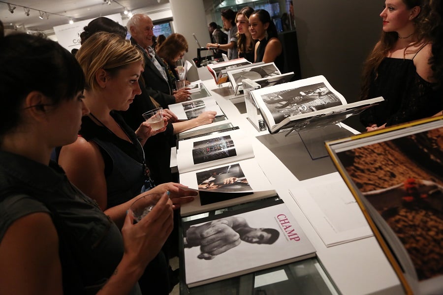 Guests peruse Magnum's book archive. Photo: J Grassi/Patrickmcmullan.com.