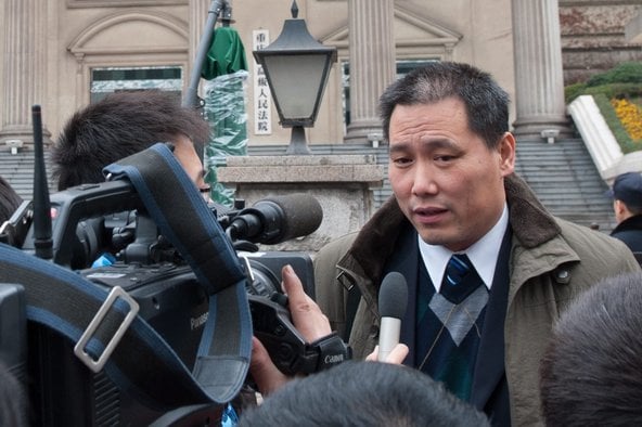 Ai Weiwei's lawyer, Pu Zhiqiang, speaking with reporters at a courthouse (December 2012). Photo: Yongping Xu, courtesy European Pressphoto Agency.
