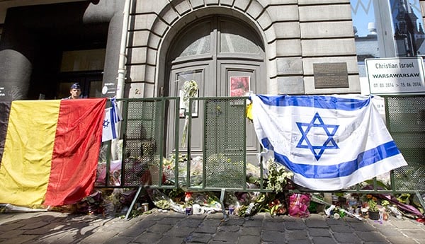 A memorial has sprung up outside the Brussels' Jewish Museum, where four were killed during the May 24 shooting. Photo: Virginia Mayo, courtesy the Associated Press.