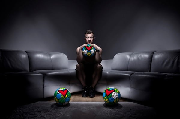 "Hublot Loves Football" ad campaign featuring soccer balls painted by Romero Britto (2014). Photo: Fred Merz, courtesy Hublot. 