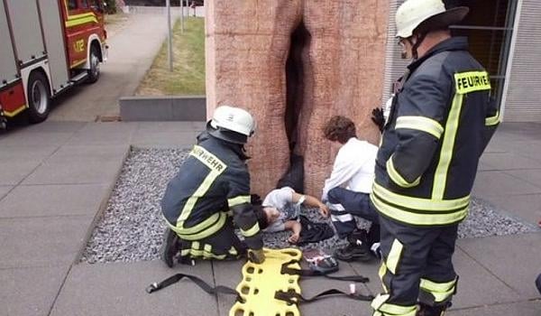 An American student being freed by firefighters from Fernando de la Jara’s marble vagina sculpture, Chacán-Pi (Making Love), at Germany’s Tübingen University.