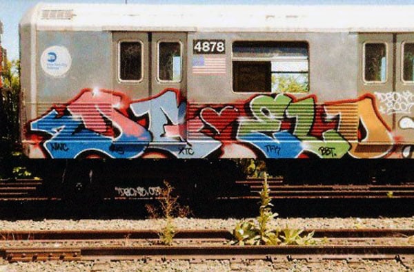 A subway car tagged by Jason Wulf, known by his graffiti tag of DG. The artist died after being electrocuted by the subway's third rail. Photo: via Animal New York.