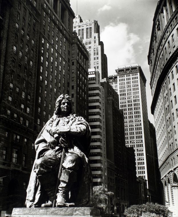 George Edwin Bissell's seven-foot-tall bronze statue of former New York mayor Abraham de Peyster, seen here at Bowling Green, looking north along Broadway (1936). Photo: Berenice Abbott, via the New York Public Library.
