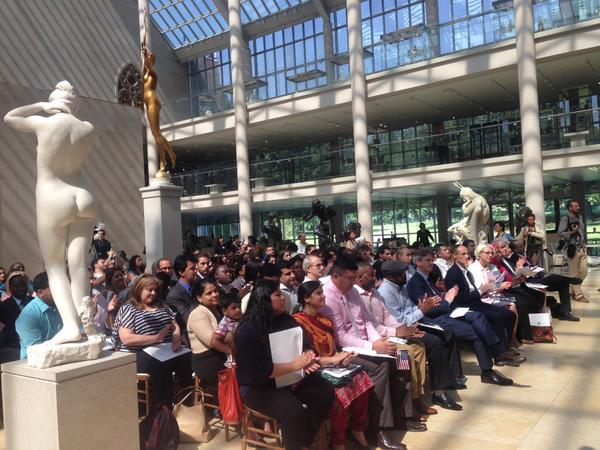 New American citizens, including Thomas P. Campbell, director of New York's Metropolitan Museum of Art, being sworn in at a ceremony in the museum's American wing. Photo: via Twitter.