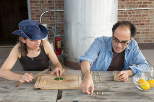 Sina Najafi and Nina Katchadourian making a salad as part of Julia Sherman's artist-made salad interview series hosted at the MoMA PS1 Salad Garden in Queens, New York. Photo: Julia Sherman.