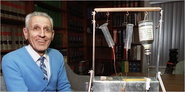 Jack "Dr. Death" Kevorkian with the Thantron, the assisted suicide device he invented, in 1991. The Thantron is now part of the collection of the Museum of Death in Los Angeles. 