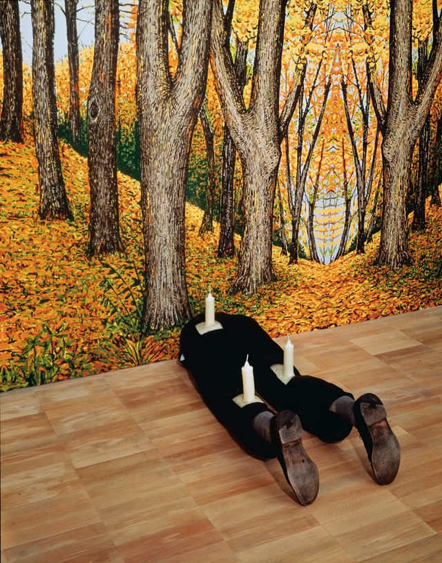 Robert Gober Untitled 1991. Wood, beeswax, leather, fabric, and human hair. 13 1/4 x 16 1/2 x 46 1/8″ (33.6 x 41.9 x 117.2 cm)  The Museum of Modern Art, New York. Gift of Werner and Elaine Dannheisser Background: Forest, 1991 Hand-painted silkscreen on paper Image Credit: K. Ignatiadis, courtesy the artist and Matthew Marks Gallery © 2014 Robert Gober