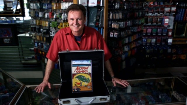 Previous owner Darren Adams with Action Comics No. 1 ahead of the sale Photo: Courtesy eBay