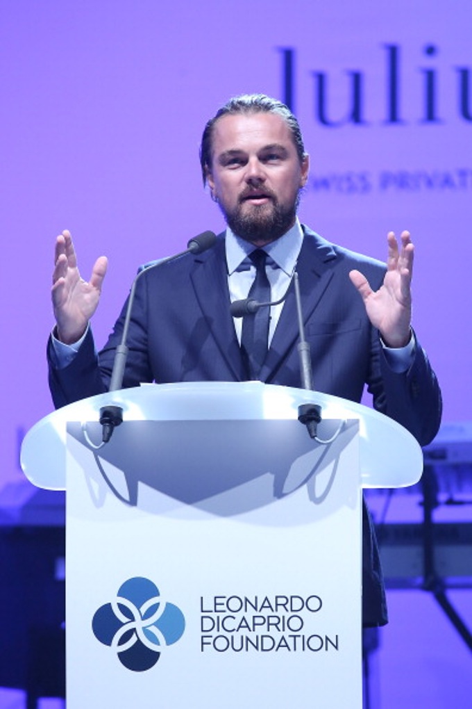Leonardo Dicaprio speaks onstage during the Leonardo Dicaprio Foundation Inaugurational Gala at Domaine Bertaud Belieu on July 23, 2014 in Saint-Tropez, France. Courtesy of Pierre Suu/French Select/Getty Images.