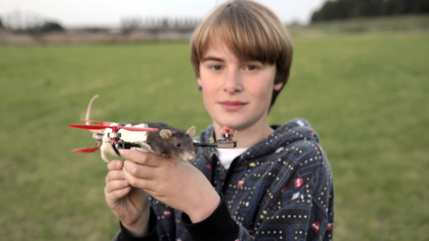 Thirteen-year-old Pepijn Bruins with the rat drone created by Arjen Beltman and Bart Jansen from his deceased pet Ratjetoe. Photo courtesy of Arjen Beltman and Bart Jansen.