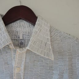 Travis Childers, shirt covered in staples (detail). Photo: Sarah Cascone.