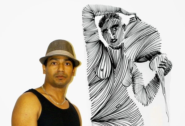 Artist SinGh with a drawing from his 