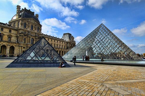 The Louvre's pyramid entrance Photo via: aneworld