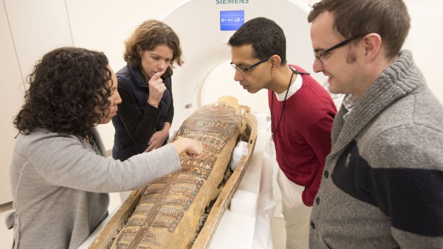 Curators and radiologists giving the third- or fourth-century B.C. mummy Pet-Menekh a CT scan at Washington University Medical Center in St. Louis. Photo: Robert Boston, courtesy CBS St. Louis.
