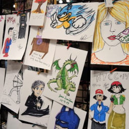 Con attendees draw at the Marvy Uchida booth at New York Comic Con. Photo: Sarah Cascone.