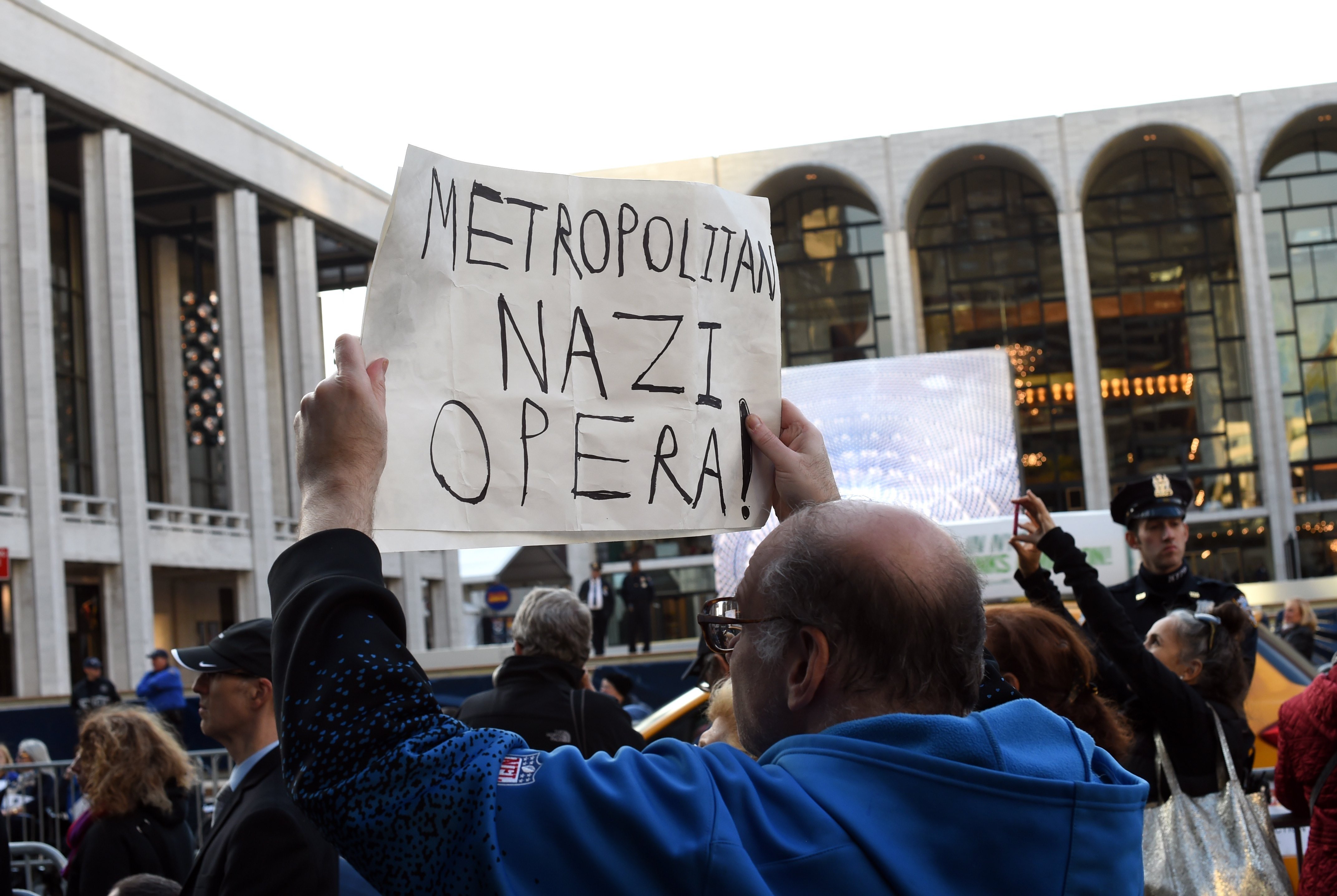 Demonstrators protest outside Lincoln Center on October 20, 2014 to criticize the Metropolitan Opera's planned performances of The Death of Klinghoffer scheduled to open October 20, 2014. Leon Klinghoffer was a disabled 69-year-old New Yorker who was shot in his wheelchair aboard the Achille Lauro Italian cruise ship after it was hijacked in 1985 by four men from the Palestinian Liberation Organization who then pushed him into the sea. Photo by Timothy A. Clary/AFP via Getty Images.