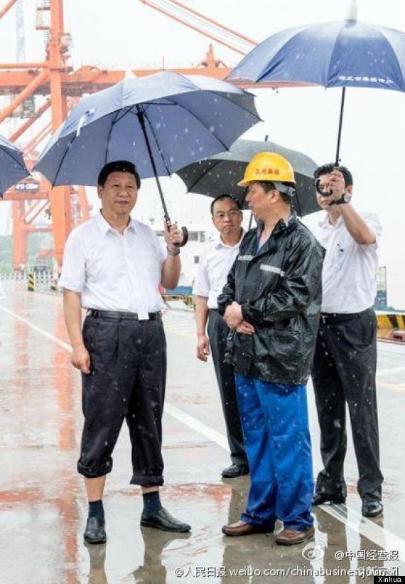 This photo of Chinese president Xi Jinping holding an umbrella won China's National News Award. Photo: Xinhua News Agency.