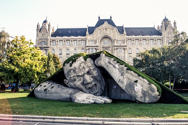 Public installation, "Ripped Up," features a stone giant emerging from the ground Photo via: László Balkányi/We Love Budapest