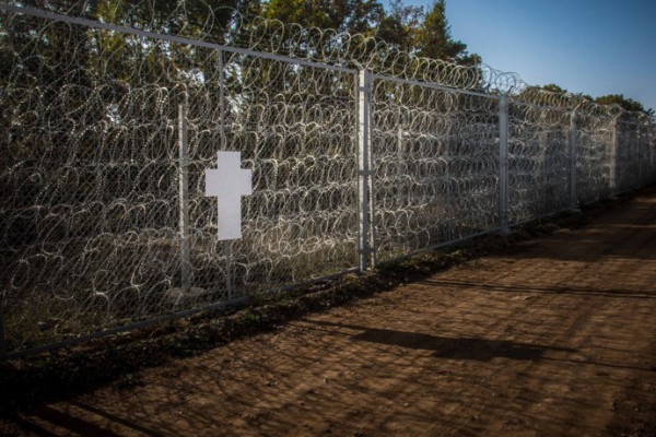 The crosses, taken from the memorial, repositioned at an unknown part of the EU border. Photo: Political Beauty