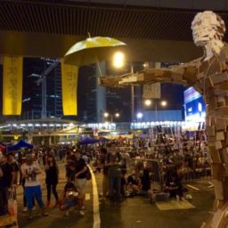 A wood art sculpture titled Umbrella Man at the Hong Kong pro-democracy protests. Photo: Daniel Schearf, courtesy Vjesnik.