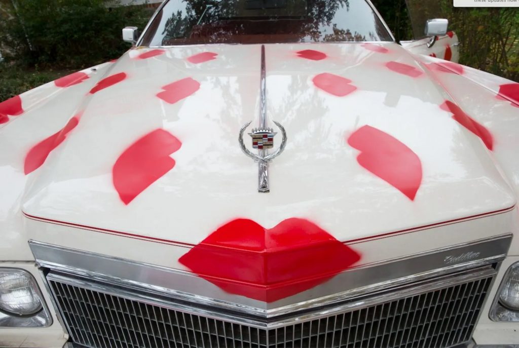 Donald Robertson and Smashbox #BingtoBasel mobile art project featuring a 1974 Cadillac covered in red lipstick lip prints. Photo courtesy of Smashbox Cosmetics.