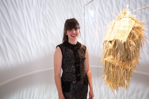 Georgia Russell with her cut paper sculpture for Ruinart<br>Photo via: <i>My Modern Met</i>
