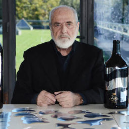 Michelangelo Pistoletto with his custom-designed bottle for Ornellaia winePhoto via: Sapori News