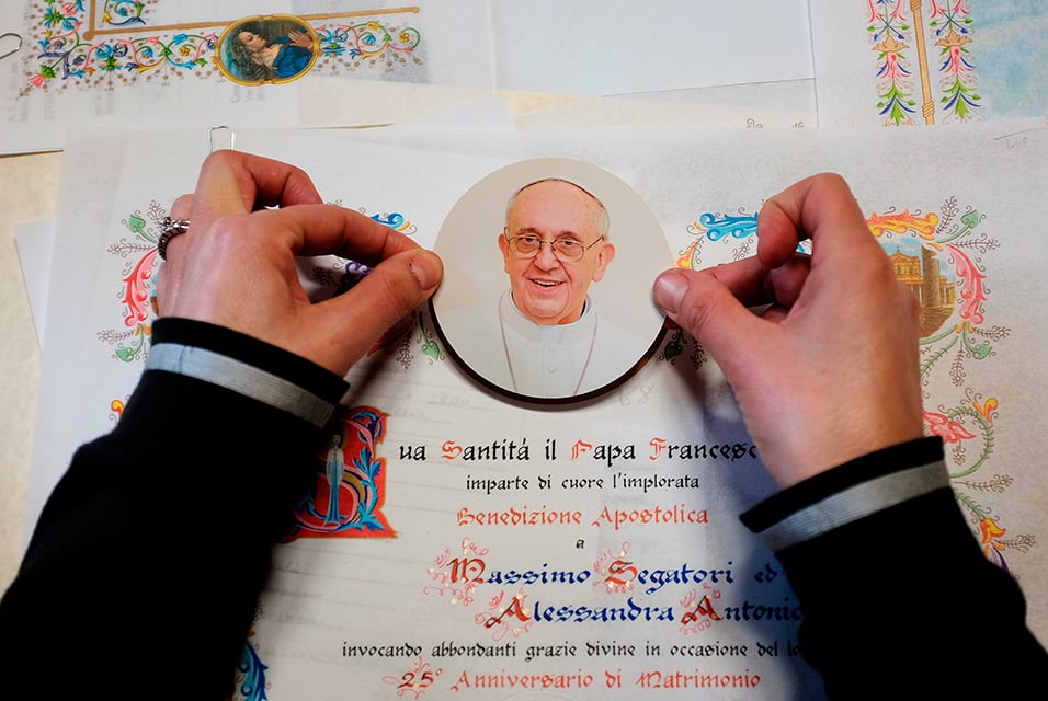 Tiziana Sereni works on a papal parchment in Rome's Rino Pensa workshop. Photo: Alberto Pizzoli, courtesy AFP Photo.