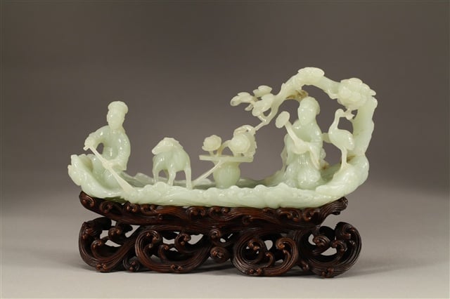 Finely carved white jade with Magu on a raft