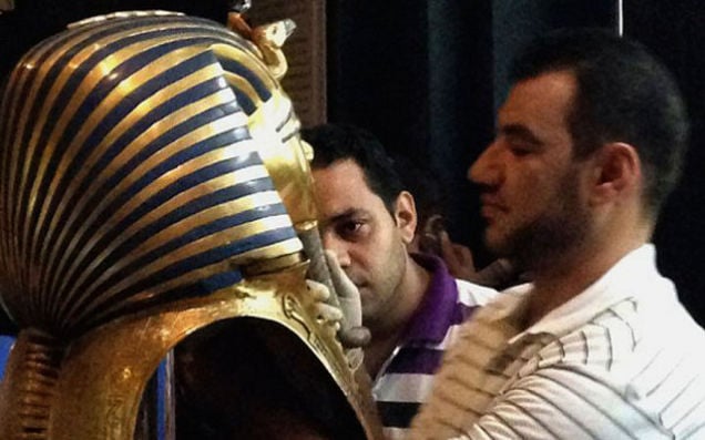 The restoration crew is seen gluing King Tut's beard back on at the Egyptian Museum in Cairo on August 12th, 2014. Photo: Jacqueline Rodriguez, courtesy the AP.