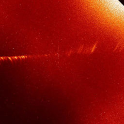 "In December 2011, SDO caught images of Comet Lovejoy traveling around the sun—the first images ever captured of a comet traveling so low in the sun's atmosphere. Here, a time lapse photo show's the comet's trajectory as it moves away from the sun. The comet's evaporating gas, caught up in the sun's magnetic field can be seen moving out in different directions." Photo: NASA/SDO.