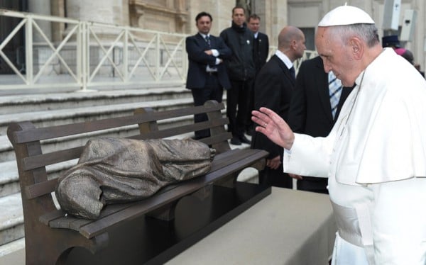 Pope Francis blessing a <em>Homeless Jesus</em> statue, delivered to him November, 2013.<br />  Photo: the Higher Learning.